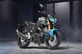 The MT-15 is a sporty street naked based on the Yamaha R15. Yamaha MT15 metallic silver cyan colour front right side static image in garage